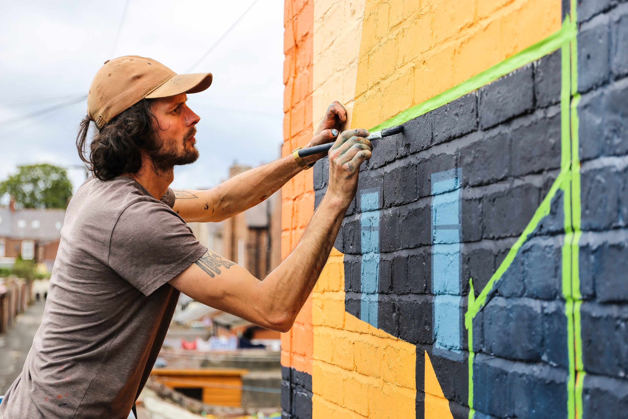 Anthony Downie painting North Shields No4, Trevor Terrace. Photo by Wayne Bordoli