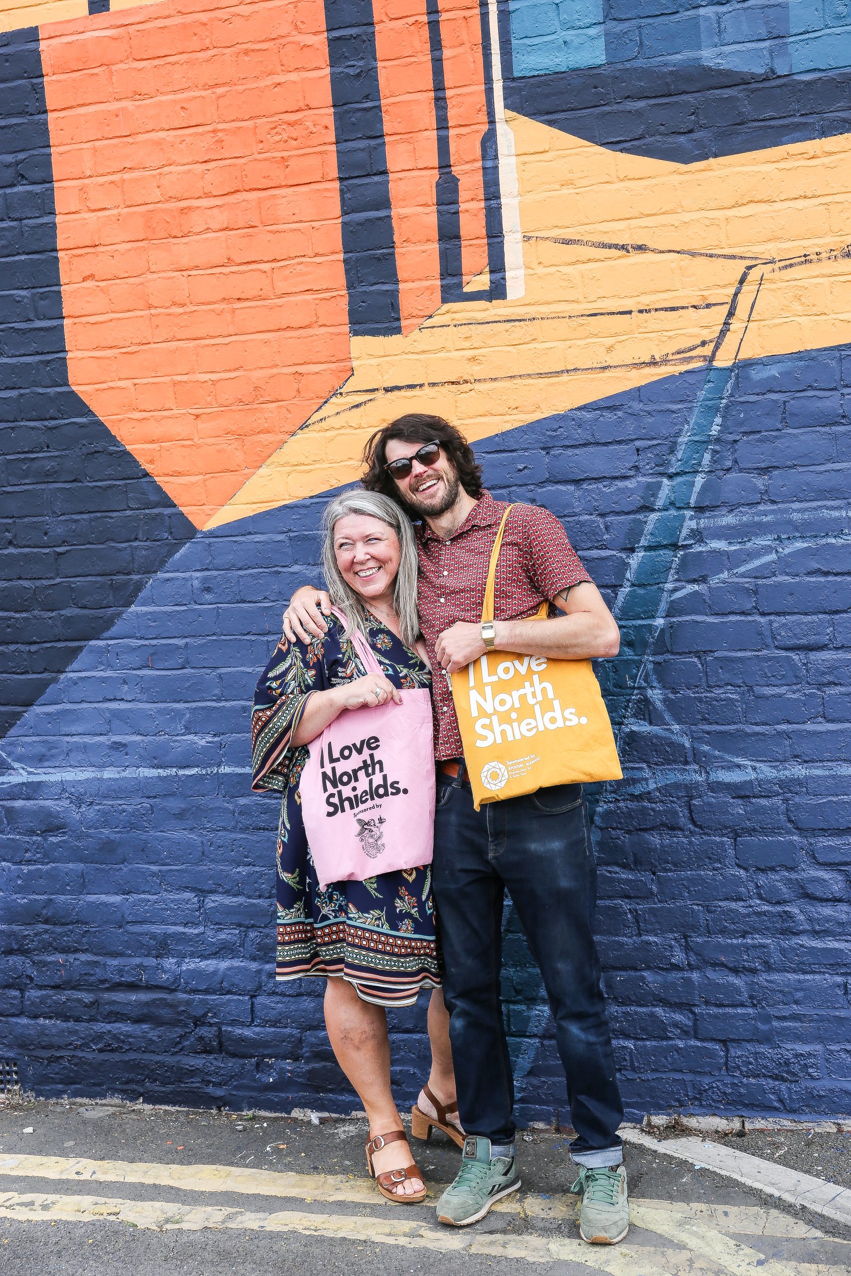 Anthony & Kirsty, owner of the house, celebrating the finished mural. Photo by Wayne Bordoli