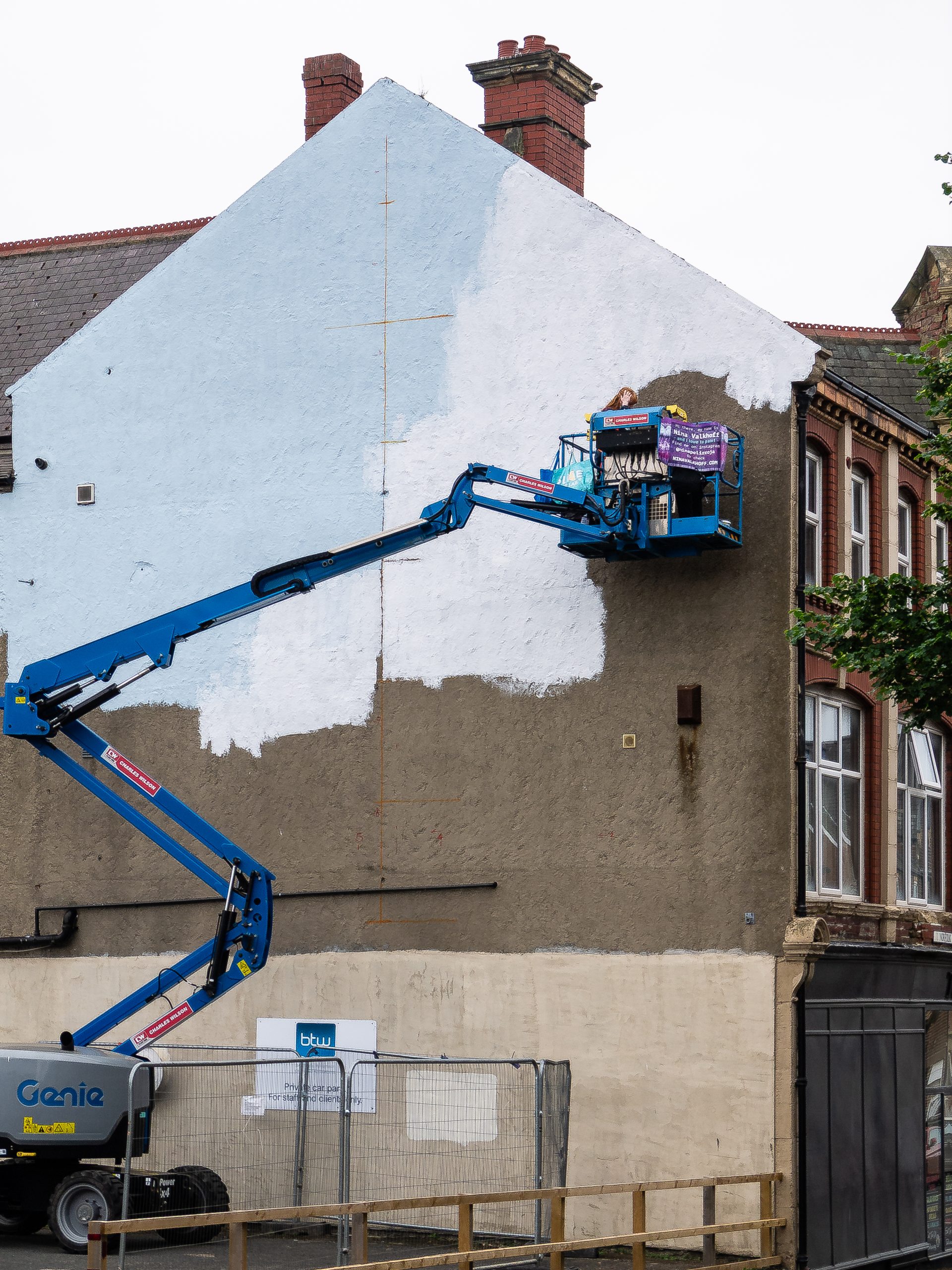 The Chase - Nina Valkhoff’s wall mural for Elevation 3 Nina Valkhoff beginning work on The Chase. Photo by Wayne Bordoli