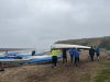 Tynemouth Rowing Club Tynemouth Rowing Club group of people carrying a white boat on the beach